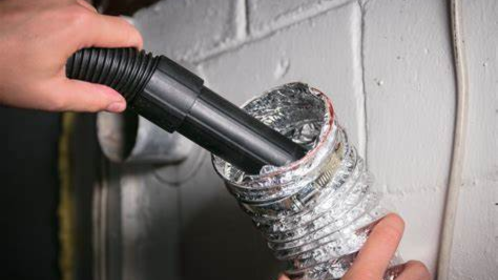 Close up of dryer vent hose being professionally cleaned