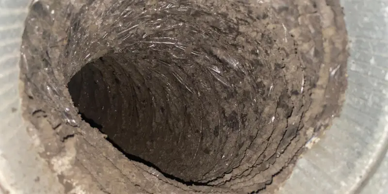 Dust and debris buildup inside residential air duct